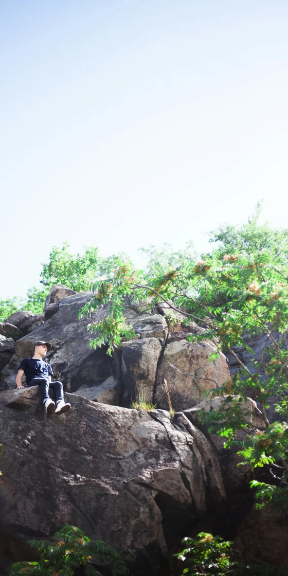 A group of hikers on a hilltop in the mist