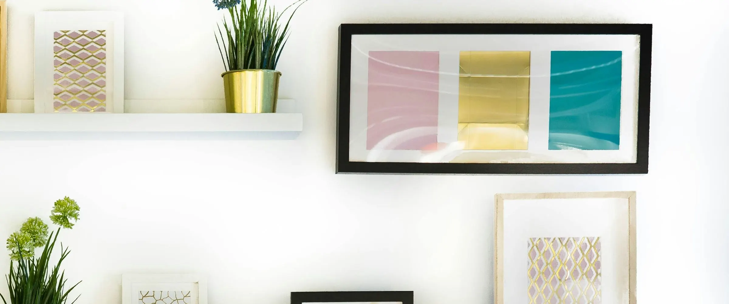 Colour-block prints above a white shelf