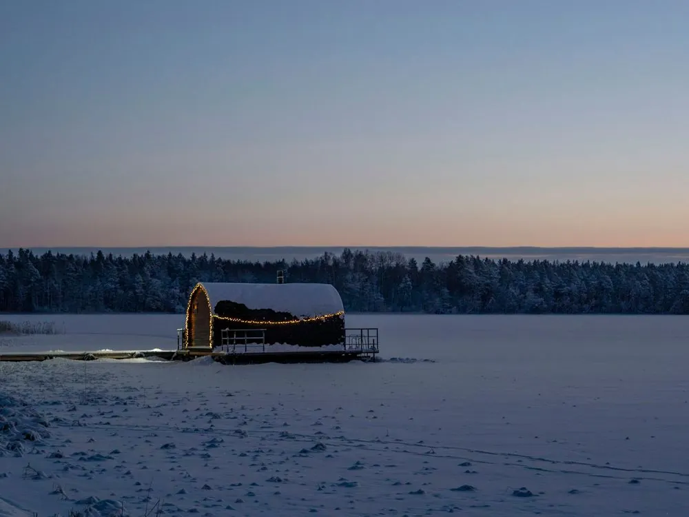 A floating cabin at dusk