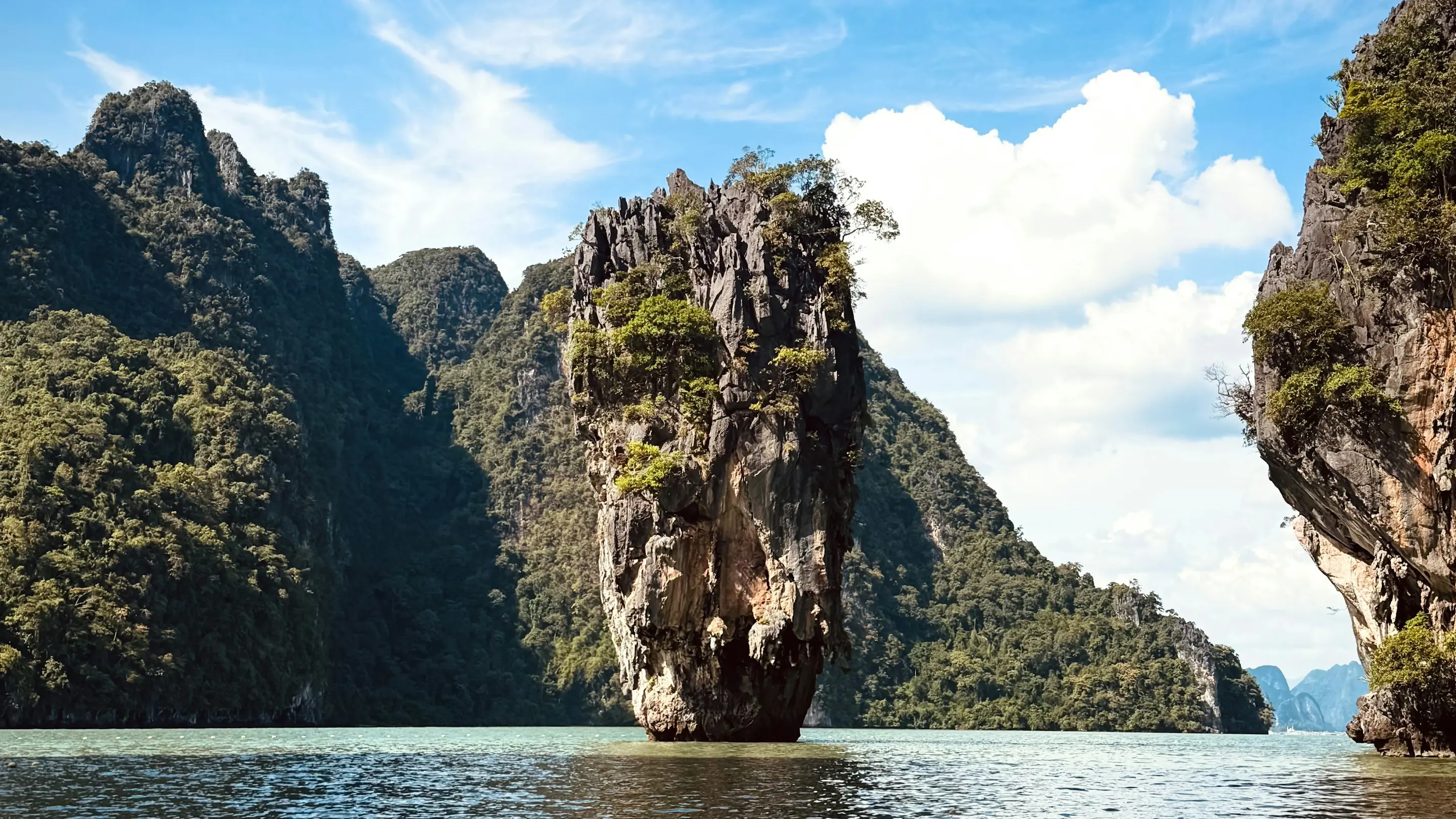 Limestone karst islands rising from calm green water