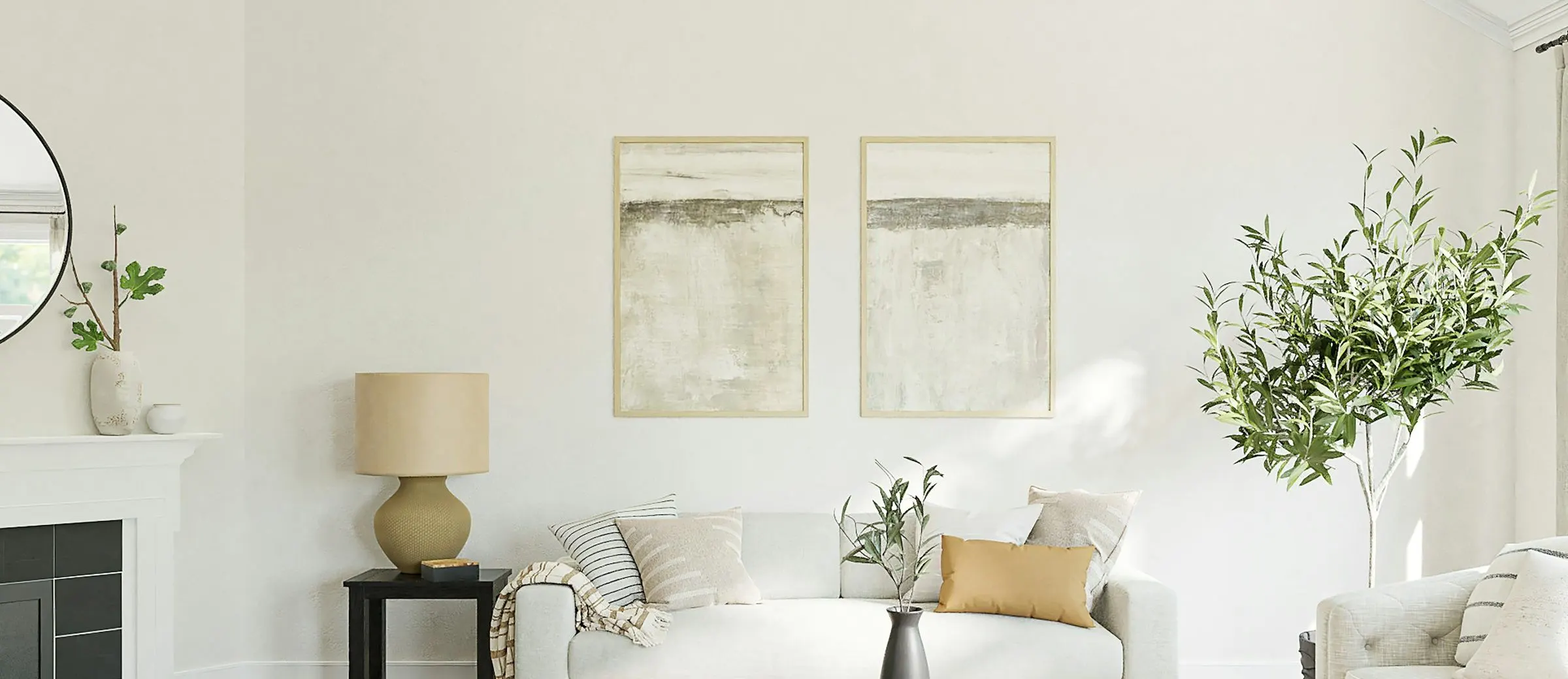 A bright living room with framed abstract prints above a low sideboard