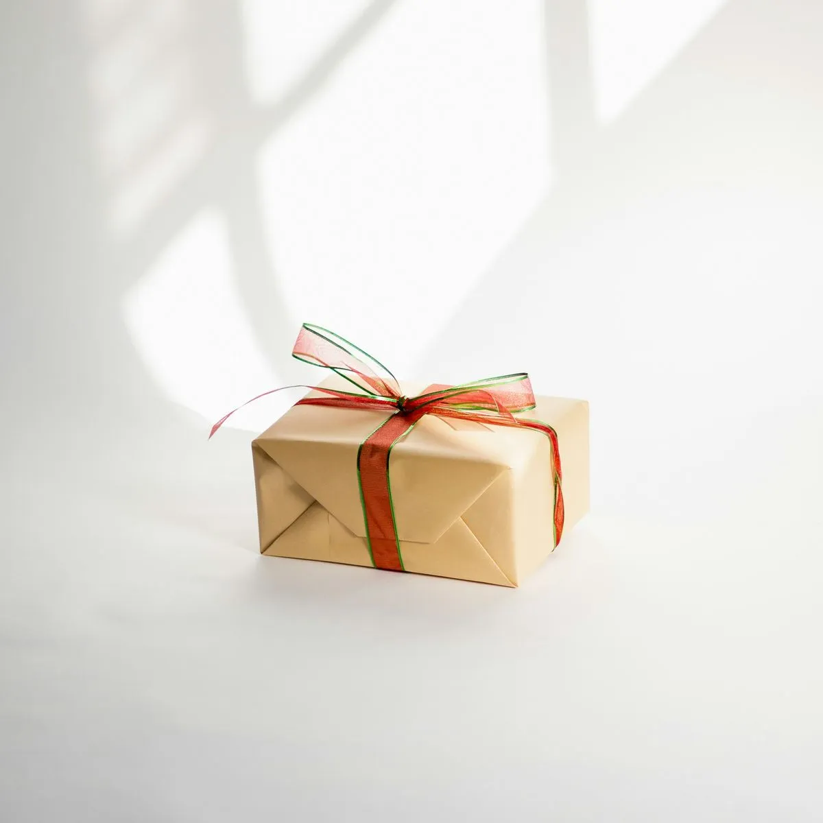 A stack of art prints tied with a ribbon