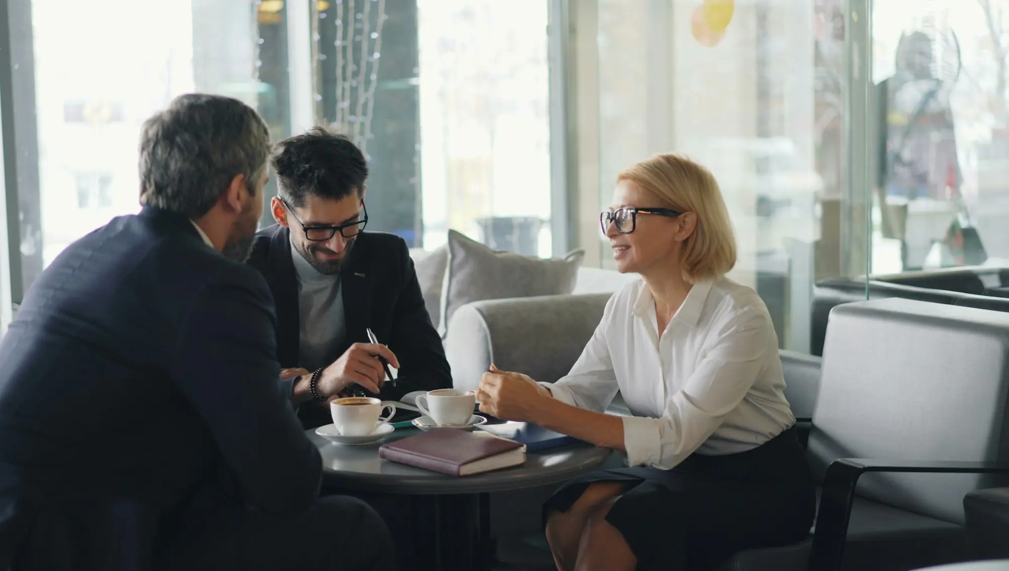 Two advisors in a meeting with a client